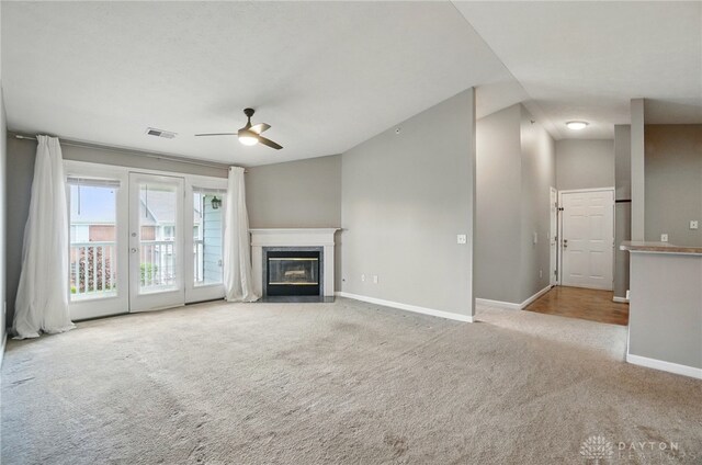 3128 Alexander Pl Unit 206, Beavercreek, OH 45431 - unfurnished living room with carpet floors, a ceiling fan, baseboards, and a premium fireplace