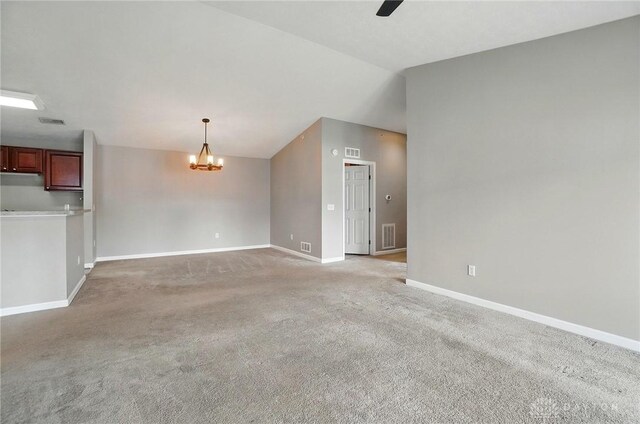 3128 Alexander Pl Unit 206, Beavercreek, OH 45431 - unfurnished living room featuring a chandelier, light colored carpet, lofted ceiling, baseboards, and a ceiling fan