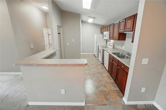 3128 Alexander Pl Unit 206, Beavercreek, OH 45431 - kitchen featuring white appliances, a sink, light countertops, baseboards, and lofted ceiling