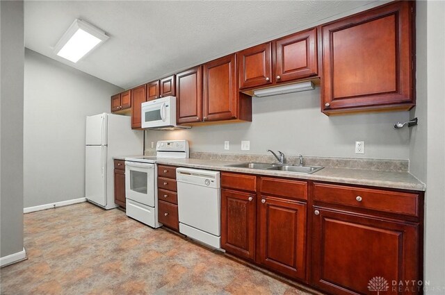 3128 Alexander Pl Unit 206, Beavercreek, OH 45431 - kitchen with white appliances, a sink, vaulted ceiling, light countertops, and baseboards