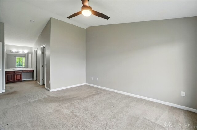 3128 Alexander Pl Unit 206, Beavercreek, OH 45431 - unfurnished bedroom featuring light colored carpet, lofted ceiling, baseboards, ensuite bathroom, and a ceiling fan