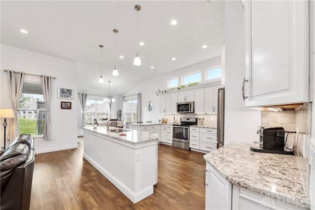kitchen featuring stainless steel appliances, a kitchen island with sink, dark wood-style flooring, white cabinetry, and recessed lighting
