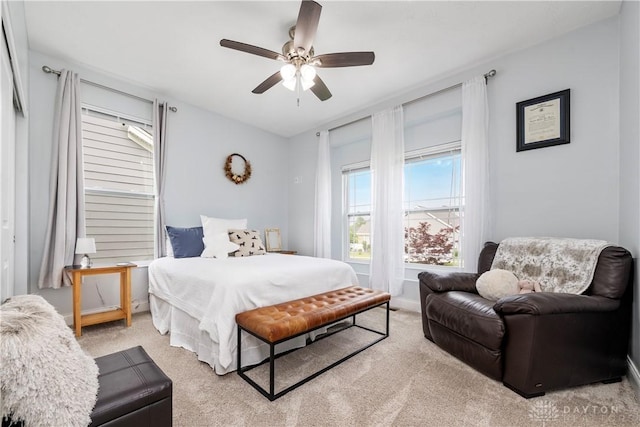 bedroom with light colored carpet and ceiling fan
