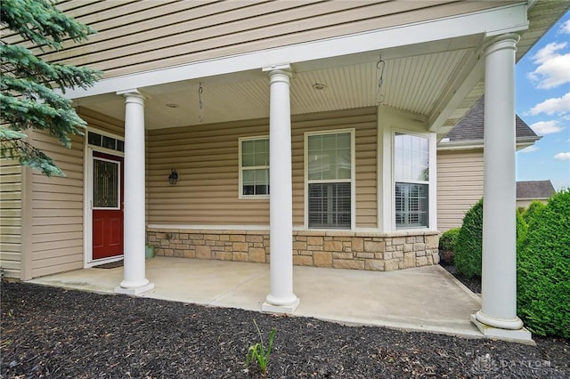 1152 Meadow Vista Dr, Maineville, OH 45039 - view of exterior entry with covered porch and stone siding
