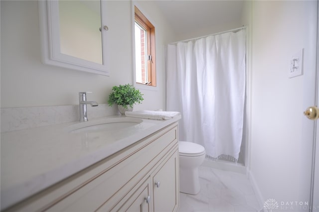 bathroom with marble finish flooring, toilet, vanity, and a shower with shower curtain