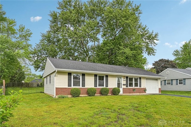 view of front of home featuring brick siding, driveway, and an attached garage