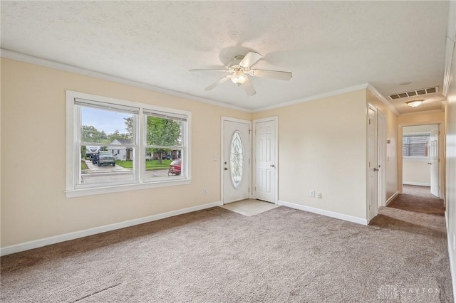 entrance foyer with crown molding, light carpet, baseboards, and ceiling fan