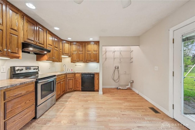 kitchen featuring stainless steel electric range oven, under cabinet range hood, black dishwasher, light wood finished floors, and recessed lighting