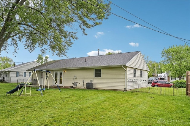 back of house featuring central AC and french doors