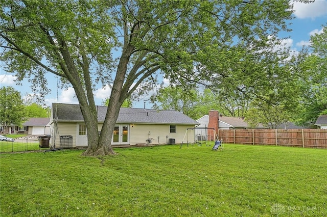 rear view of house with central air condition unit