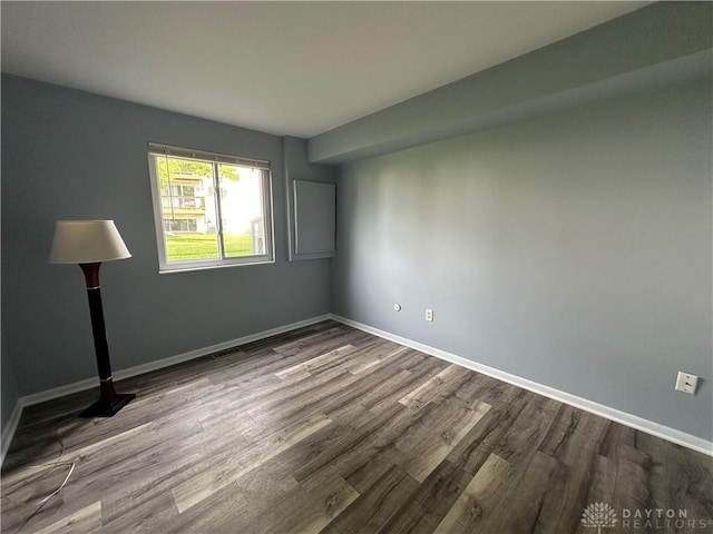 5700 Coach Dr Unit B, Kettering, OH 45440 - unfurnished room featuring dark wood-style floors and baseboards