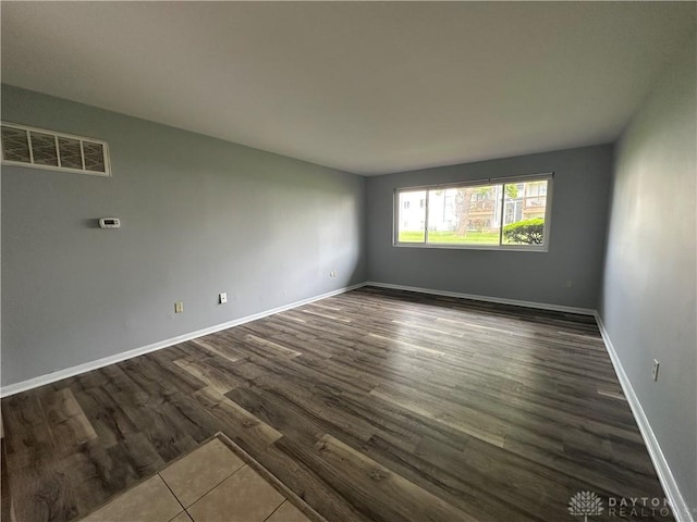 5700 Coach Dr Unit B, Kettering, OH 45440 - unfurnished room with dark wood-style floors and baseboards