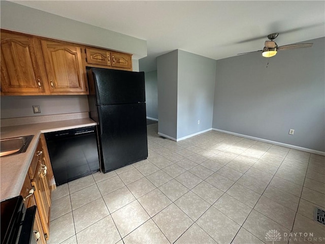 5700 Coach Dr Unit B, Kettering, OH 45440 - kitchen featuring black appliances, a ceiling fan, light tile patterned floors, and baseboards