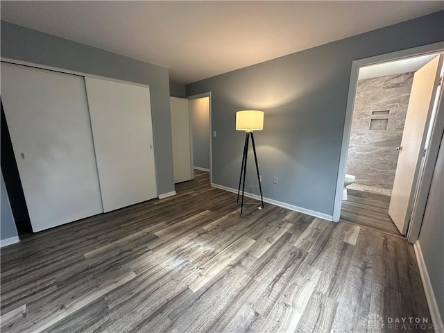 5700 Coach Dr Unit B, Kettering, OH 45440 - unfurnished bedroom featuring wood finished floors, baseboards, and a closet