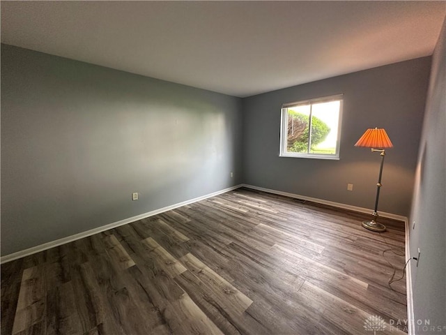 5700 Coach Dr Unit B, Kettering, OH 45440 - empty room with dark wood-type flooring and baseboards