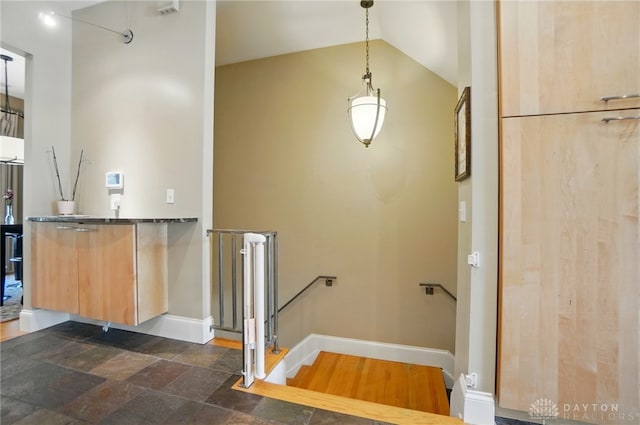 2731 Cleinview Ave Unit 2, Cincinnati, OH 45206 - bathroom with baseboards, lofted ceiling, and stone finish floors