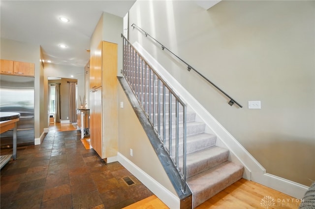 2731 Cleinview Ave Unit 2, Cincinnati, OH 45206 - stairs featuring baseboards, recessed lighting, and stone finish floors