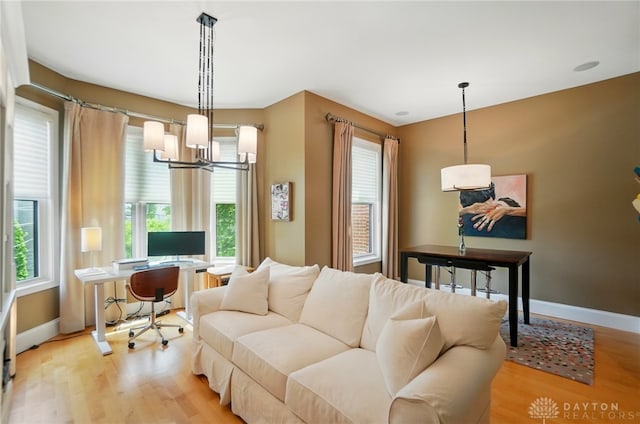 2731 Cleinview Ave Unit 2, Cincinnati, OH 45206 - living room with light wood finished floors, a chandelier, plenty of natural light, and an office area