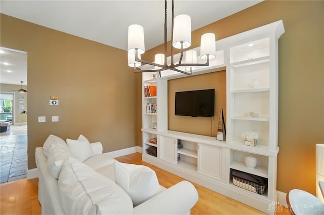 2731 Cleinview Ave Unit 2, Cincinnati, OH 45206 - living room with a chandelier and light wood-style floors