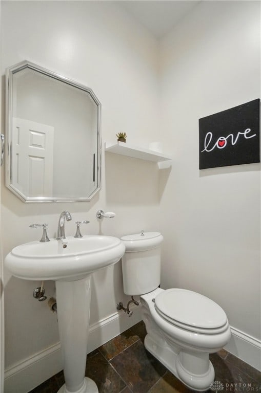 2731 Cleinview Ave Unit 2, Cincinnati, OH 45206 - half bathroom featuring baseboards, toilet, and stone finish floors