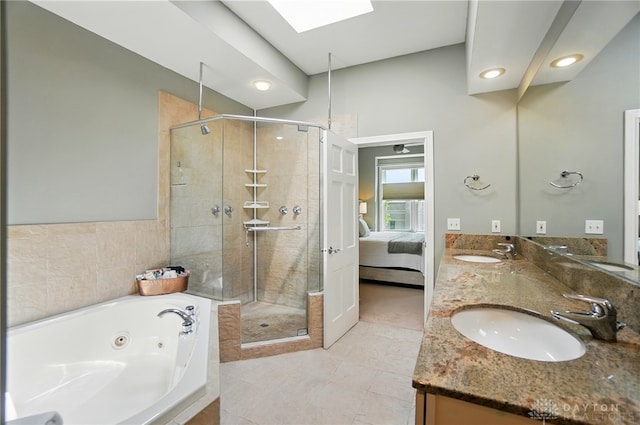 2731 Cleinview Ave Unit 2, Cincinnati, OH 45206 - bathroom featuring a shower stall, a whirlpool tub, a skylight, connected bathroom, and double vanity