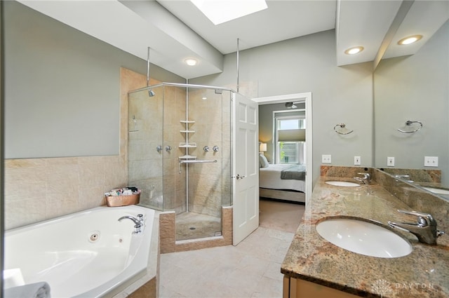 2731 Cleinview Ave Unit 2, Cincinnati, OH 45206 - bathroom with a shower stall, ensuite bathroom, a tub with jets, a skylight, and double vanity