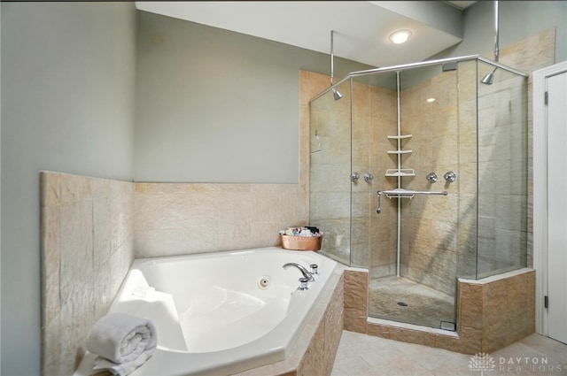 2731 Cleinview Ave Unit 2, Cincinnati, OH 45206 - bathroom with a stall shower, a whirlpool tub, and tile patterned flooring
