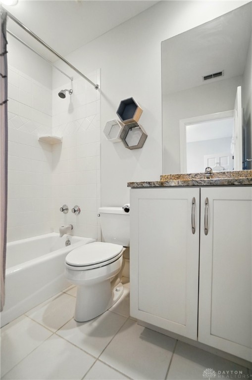 2731 Cleinview Ave Unit 2, Cincinnati, OH 45206 - bathroom with toilet, vanity, tile patterned flooring, and shower / tub combo with curtain