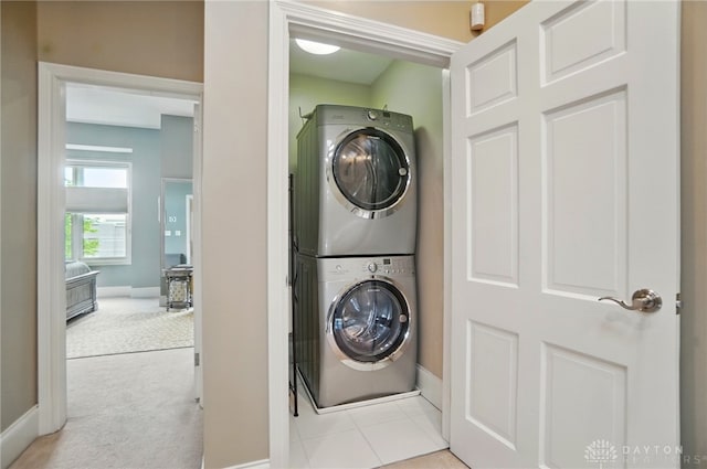 2731 Cleinview Ave Unit 2, Cincinnati, OH 45206 - clothes washing area with estacked washer and dryer, baseboards, and carpet flooring