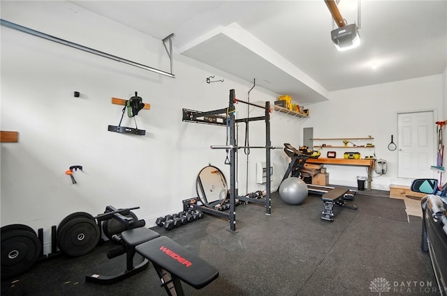 2731 Cleinview Ave Unit 2, Cincinnati, OH 45206 - workout room featuring a garage, a workshop area, and electric panel