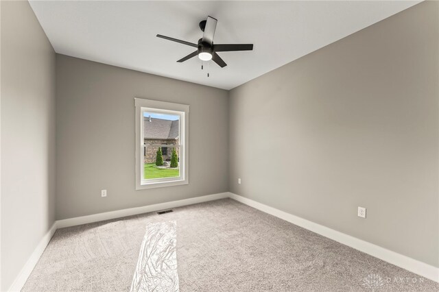 755 W Bentley Cir, Troy, OH 45373 - carpeted spare room with ceiling fan and baseboards