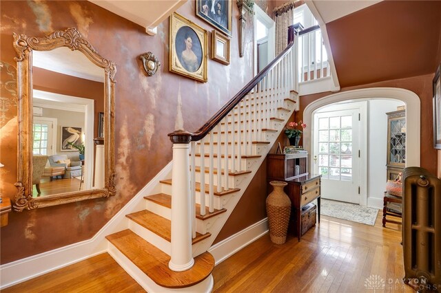65 N Central Ave, Fairborn, OH 45324 - staircase with wood finished floors, plenty of natural light, arched walkways, and radiator heating unit