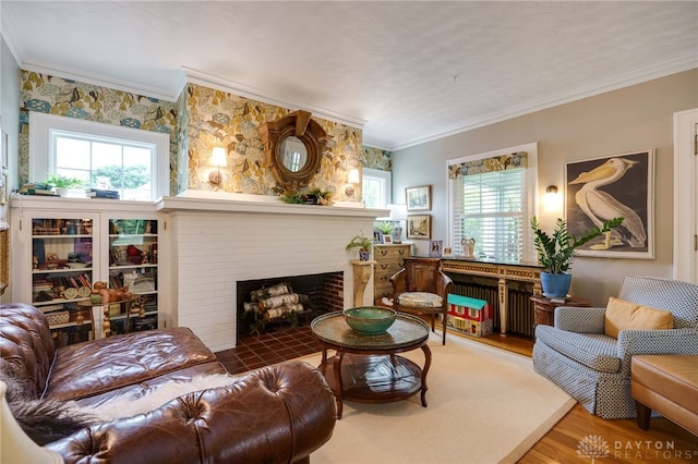 65 N Central Ave, Fairborn, OH 45324 - living room with wood finished floors, healthy amount of natural light, ornamental molding, and a brick fireplace