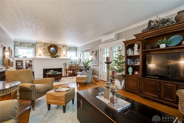 65 N Central Ave, Fairborn, OH 45324 - living room with a brick fireplace, healthy amount of natural light, light wood finished floors, an AC wall unit, and ornamental molding