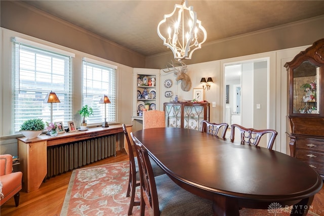 65 N Central Ave, Fairborn, OH 45324 - dining area featuring radiator, light wood-type flooring, a chandelier, and crown molding