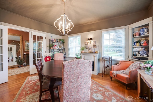65 N Central Ave, Fairborn, OH 45324 - dining room with crown molding, a chandelier, light wood-type flooring, and french doors