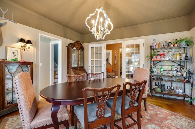 65 N Central Ave, Fairborn, OH 45324 - dining area with a chandelier, stairs, french doors, crown molding, and a bar
