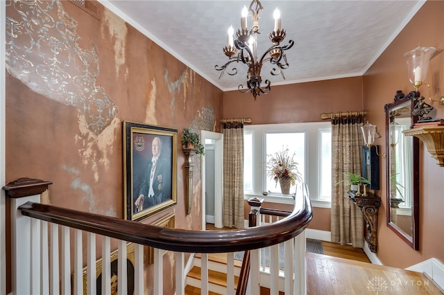 65 N Central Ave, Fairborn, OH 45324 - corridor featuring a chandelier, wood finished floors, an upstairs landing, and ornamental molding