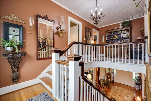 65 N Central Ave, Fairborn, OH 45324 - stairway featuring wood finished floors, a chandelier, and ornamental molding