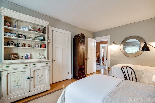 65 N Central Ave, Fairborn, OH 45324 - bedroom with light wood-type flooring and crown molding
