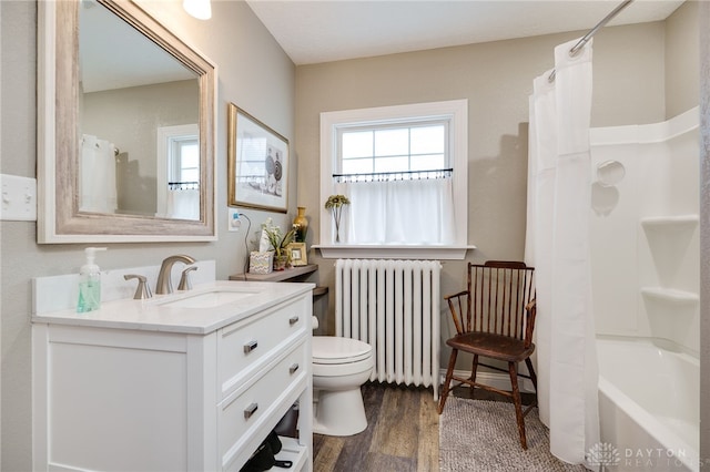 65 N Central Ave, Fairborn, OH 45324 - full bathroom with radiator, vanity, wood finished floors, and shower / bath combination with curtain