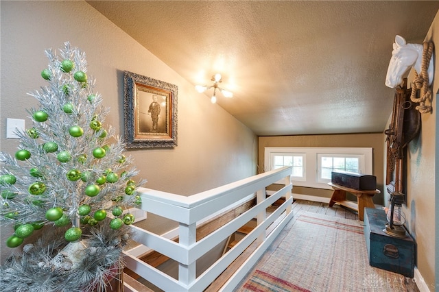 65 N Central Ave, Fairborn, OH 45324 - stairway featuring vaulted ceiling, a textured ceiling, and a textured wall