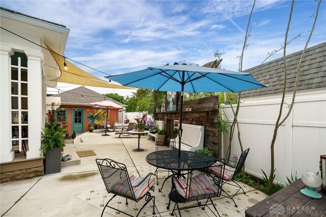 65 N Central Ave, Fairborn, OH 45324 - fenced backyard with outdoor dining area, a patio, and an outbuilding