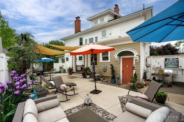 65 N Central Ave, Fairborn, OH 45324 - back of property featuring a patio, a chimney, and an outdoor living space