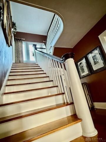 65 N Central Ave, Fairborn, OH 45324 - stairway with decorative columns and wood finished floors