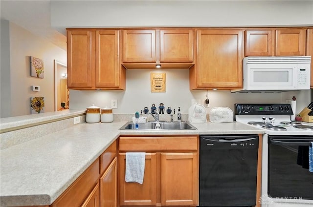 kitchen with white microwave, dishwasher, range with electric stovetop, a sink, and light countertops