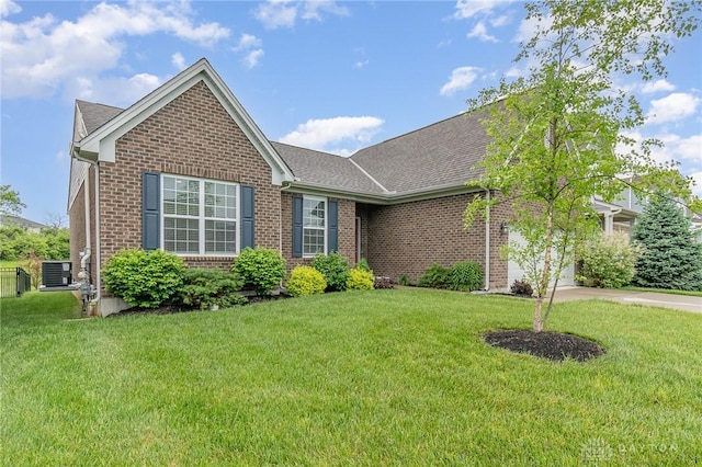 3631 Capitol Ave, Mason, OH 45040 - view of front of home featuring brick siding, a front yard, driveway, a shingled roof, and an attached garage