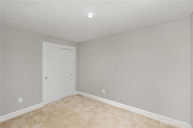 3631 Capitol Ave, Mason, OH 45040 - unfurnished bedroom with light colored carpet, baseboards, and a closet