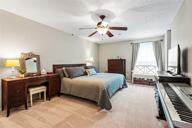 bedroom with light carpet, ceiling fan, and baseboards