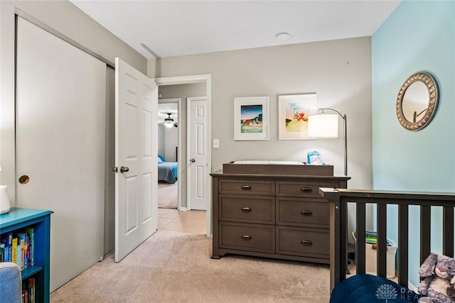 bedroom featuring light carpet